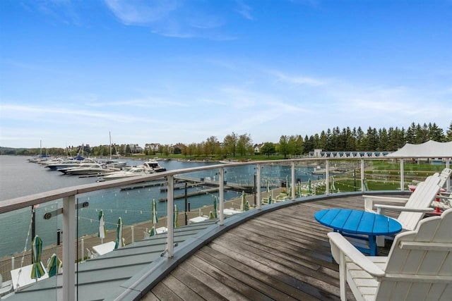 824 Vista Dr Unit 64, Bay Harbor, MI 49770 - deck with a water view