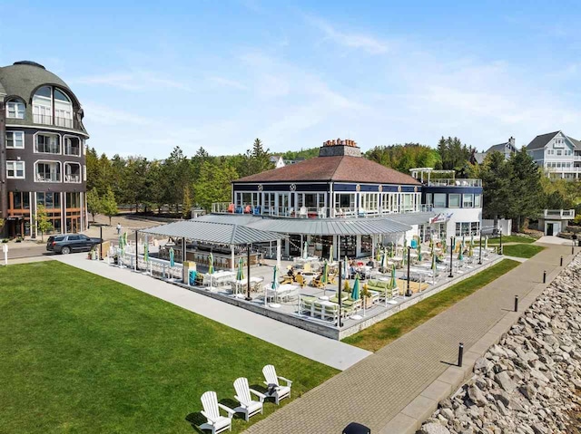 824 Vista Dr Unit 64, Bay Harbor, MI 49770 - view of community featuring a lawn