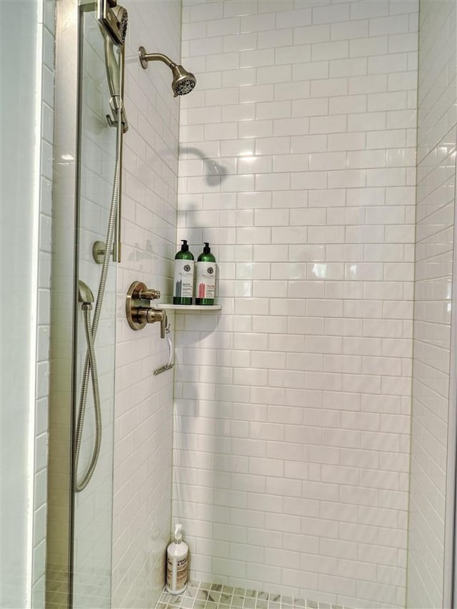 103 Riverwalk Ln Unit 103, Charlevoix, MI 49720 - full bathroom featuring a shower stall
