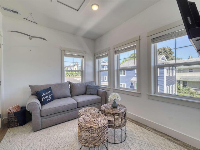 103 Riverwalk Ln Unit 103, Charlevoix, MI 49720 - living area with wood finished floors and baseboards