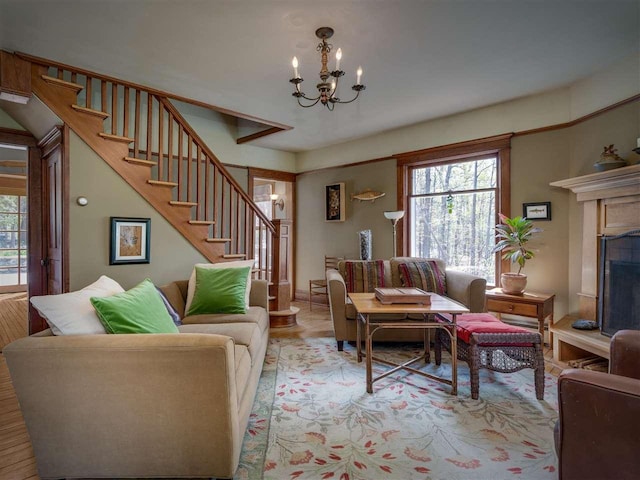 7671 Hoyt Rd, Harbor Springs, MI 49740 - living area with stairway, a chandelier, and a fireplace with raised hearth