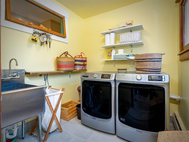 7671 Hoyt Rd, Harbor Springs, MI 49740 - washroom with washing machine and clothes dryer and tile patterned flooring