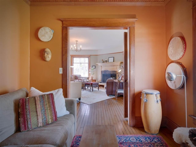 7671 Hoyt Rd, Harbor Springs, MI 49740 - hallway with hardwood / wood-style floors, a chandelier, crown molding, and baseboards