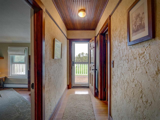 7671 Hoyt Rd, Harbor Springs, MI 49740 - hall featuring a baseboard heating unit, plenty of natural light, crown molding, wood ceiling, and a textured wall