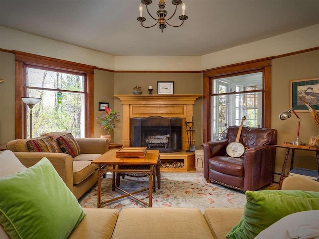 7671 Hoyt Rd, Harbor Springs, MI 49740 - living area featuring plenty of natural light, a chandelier, and a fireplace with raised hearth