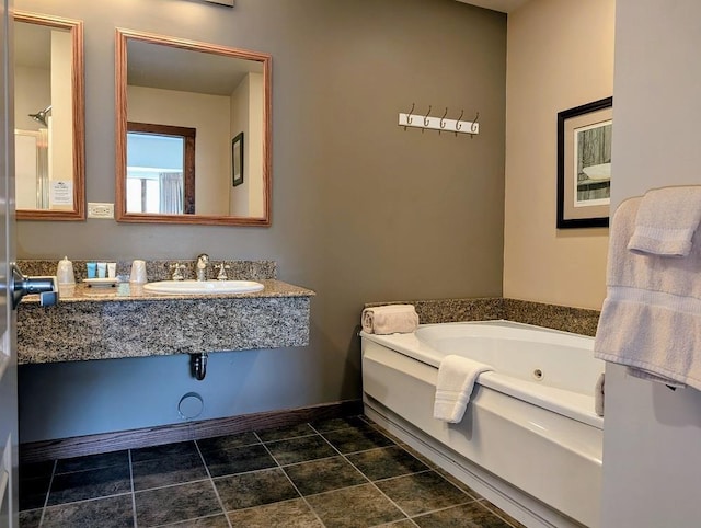 2400 Troon S Unit 4101, Bellaire, MI 49615 - bathroom featuring a sink, a tub with jets, and baseboards