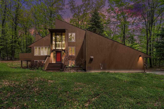 1509 Kingswood, Harbor Springs, MI 49740 - view of front of property featuring a front yard and a chimney