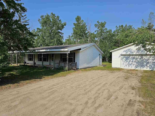 394 Townline Rd, Pellston, MI 49769 - view of front of property with covered porch and a garage