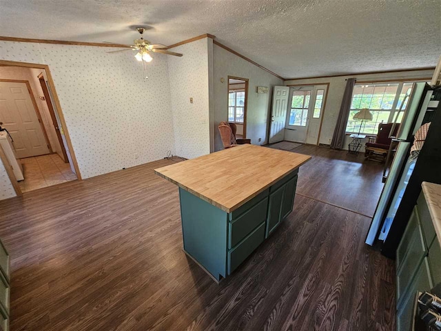 394 Townline Rd, Pellston, MI 49769 - kitchen featuring ornamental molding, dark wood-style floors, butcher block countertops, a textured ceiling, and wallpapered walls