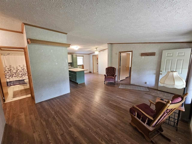 394 Townline Rd, Pellston, MI 49769 - living area featuring a textured ceiling, dark wood-style flooring, a ceiling fan, and crown molding