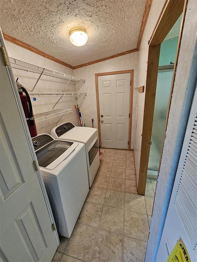394 Townline Rd, Pellston, MI 49769 - laundry room with separate washer and dryer, ornamental molding, and a textured ceiling