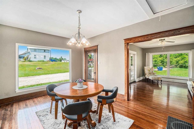 5791 Lebaron St, Levering, MI 49755 - dining space featuring attic access, dark wood-type flooring, and baseboards