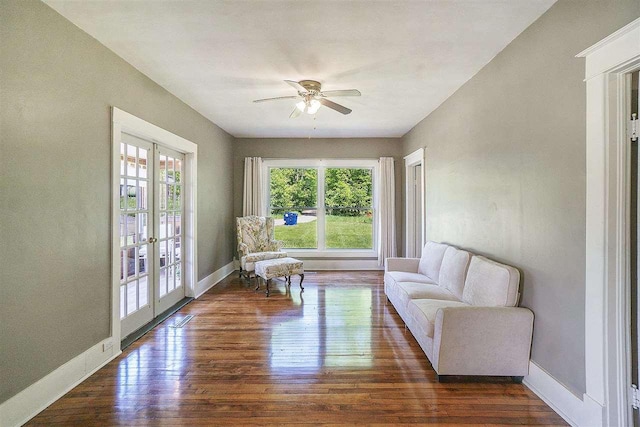 5791 Lebaron St, Levering, MI 49755 - living area with a ceiling fan, french doors, wood finished floors, and baseboards