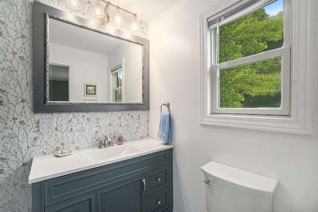 5791 Lebaron St, Levering, MI 49755 - bathroom featuring wallpapered walls, vanity, and toilet