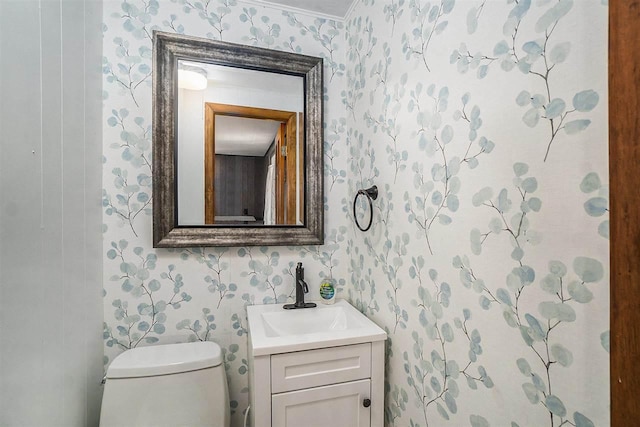 5791 Lebaron St, Levering, MI 49755 - half bath featuring wallpapered walls, vanity, and toilet