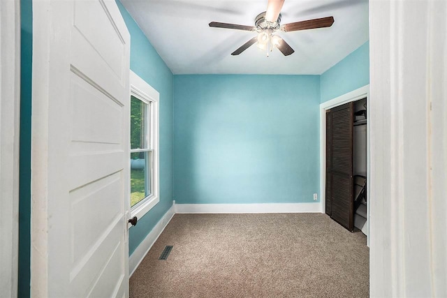 5791 Lebaron St, Levering, MI 49755 - unfurnished bedroom with carpet flooring, baseboards, a closet, and ceiling fan