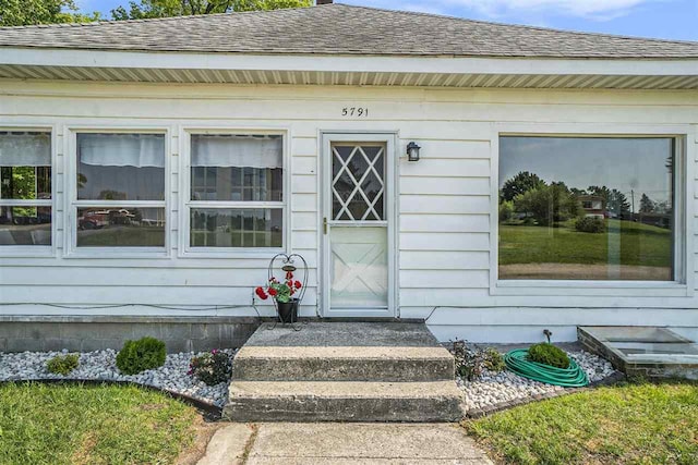 5791 Lebaron St, Levering, MI 49755 - view of exterior entry featuring roof with shingles