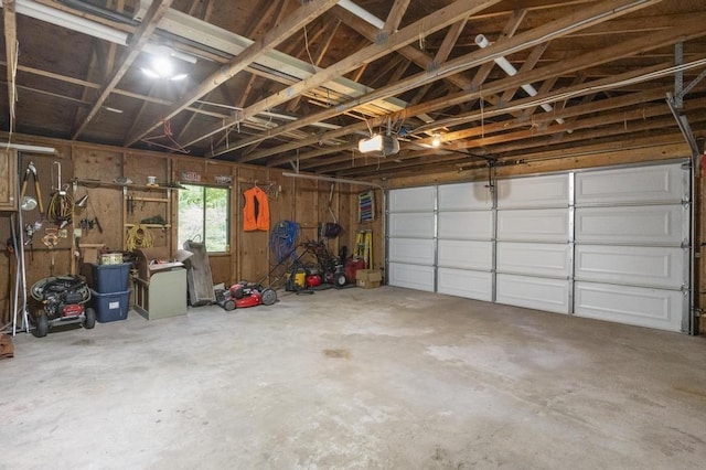 12593 Fern Pl, Charlevoix, MI 49720 - garage featuring a garage door opener