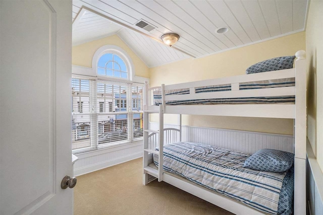 193 E Main St Unit 4, Harbor Springs, MI 49740 - carpeted bedroom featuring vaulted ceiling