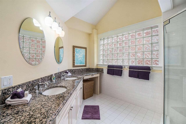 195 E Main St Unit 5, Harbor Springs, MI 49740 - full bathroom with tile patterned floors, double vanity, tiled shower, and lofted ceiling
