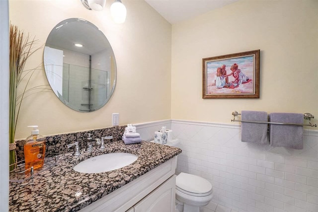 195 E Main St Unit 5, Harbor Springs, MI 49740 - full bath with vanity, a wainscoted wall, toilet, a shower, and tile walls