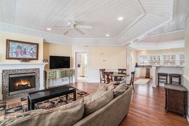195 E Main St Unit 5, Harbor Springs, MI 49740 - living area with wood ceiling, wood finished floors, wine cooler, a ceiling fan, and a glass covered fireplace