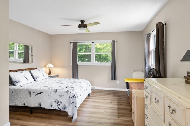 1105 Grant St, Charlevoix, MI 49720 - bedroom featuring light wood-type flooring, baseboards, and ceiling fan
