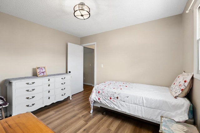 1105 Grant St, Charlevoix, MI 49720 - bedroom with wood finished floors