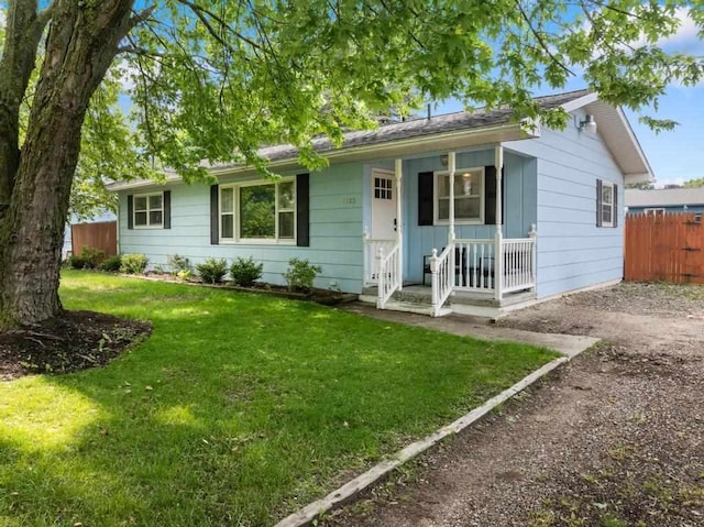1105 Grant St, Charlevoix, MI 49720 - single story home featuring covered porch and dirt driveway