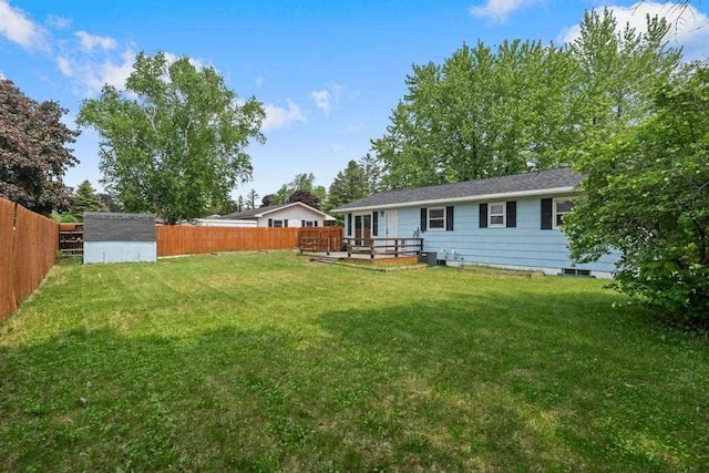 1105 Grant St, Charlevoix, MI 49720 - view of yard with a wooden deck