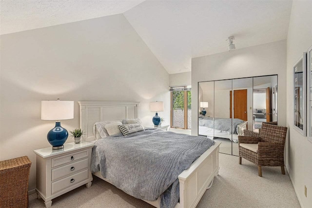 3480 Lakeside Dr N Unit 35, Petoskey, MI 49770 - bedroom with light colored carpet and high vaulted ceiling