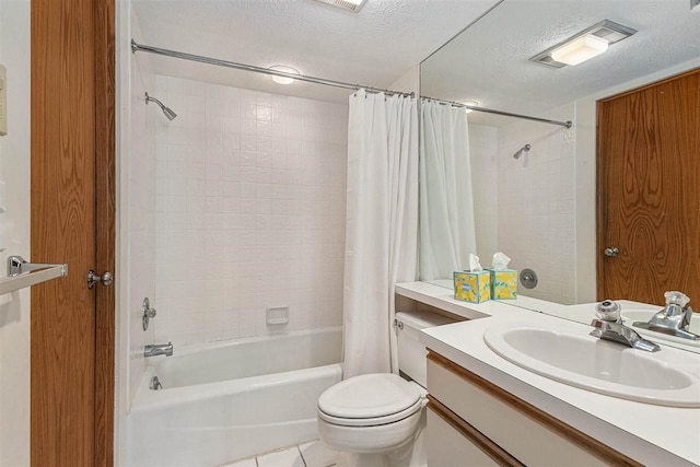 3480 Lakeside Dr N Unit 35, Petoskey, MI 49770 - bathroom featuring a textured ceiling, shower / bath combo, vanity, tile patterned floors, and toilet