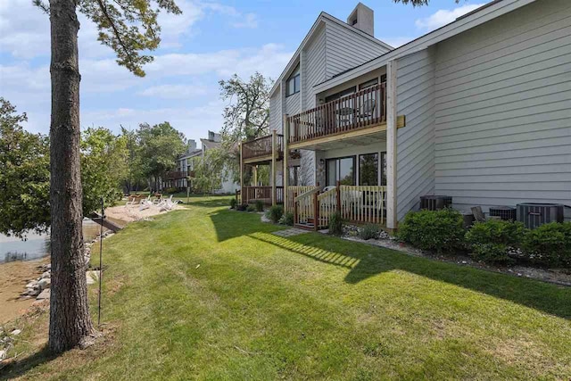 3480 Lakeside Dr N Unit 35, Petoskey, MI 49770 - view of grassy yard featuring central AC and a balcony