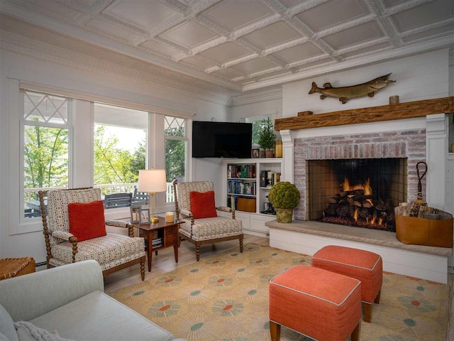 169 E Shadow Trails Rd, Boyne City, MI 49712 - living room with wood finished floors, an ornate ceiling, and a brick fireplace