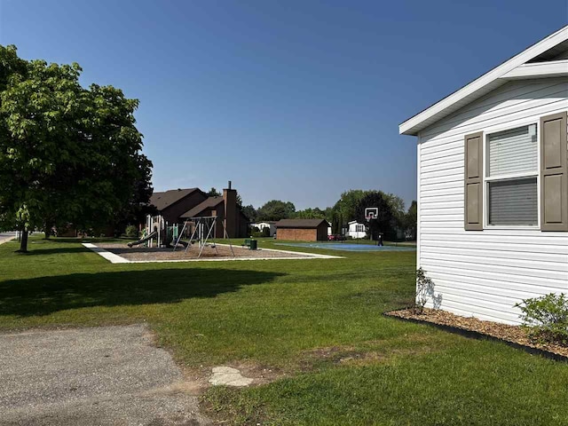 6685 M-66 N, Charlevoix, MI 49720 - view of green lawn with a playground