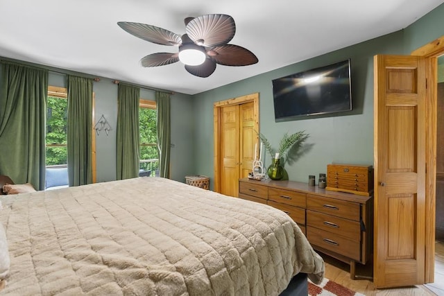 1367 Zink Rd, Boyne City, MI 49712 - bedroom featuring ceiling fan and light wood-style floors