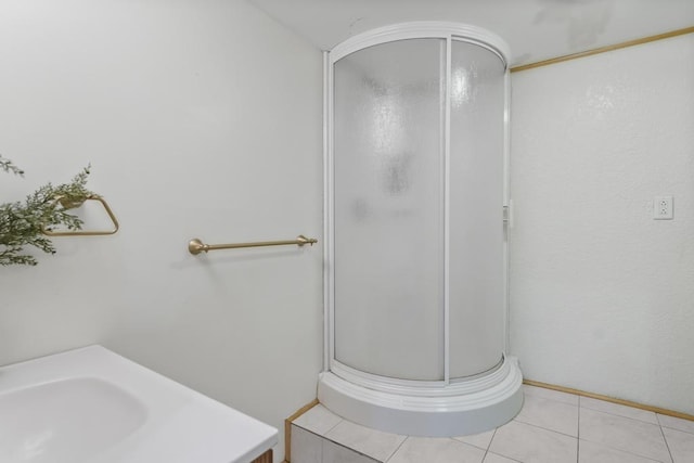 1367 Zink Rd, Boyne City, MI 49712 - bathroom featuring a stall shower, vanity, and tile patterned flooring