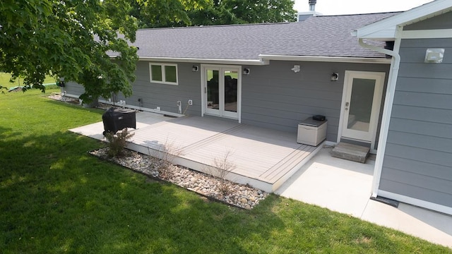 8512 Dutchman Bay Rd, East Jordan, MI 49727 - back of house featuring a deck, a yard, and roof with shingles