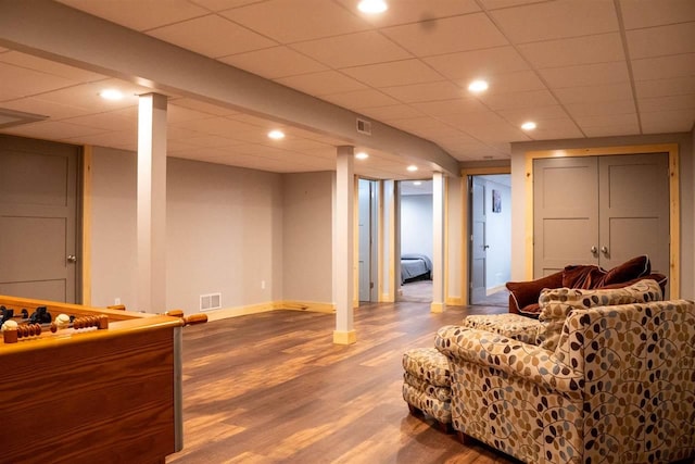 8512 Dutchman Bay Rd, East Jordan, MI 49727 - living room featuring wood finished floors, recessed lighting, and a paneled ceiling