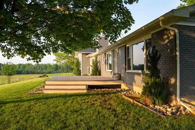 8512 Dutchman Bay Rd, East Jordan, MI 49727 - view of green lawn with a wooden deck