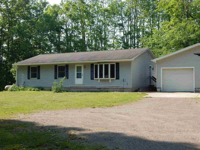 1575 Roy Rd, Petoskey, MI 49770 - single story home featuring a garage, driveway, and a front yard