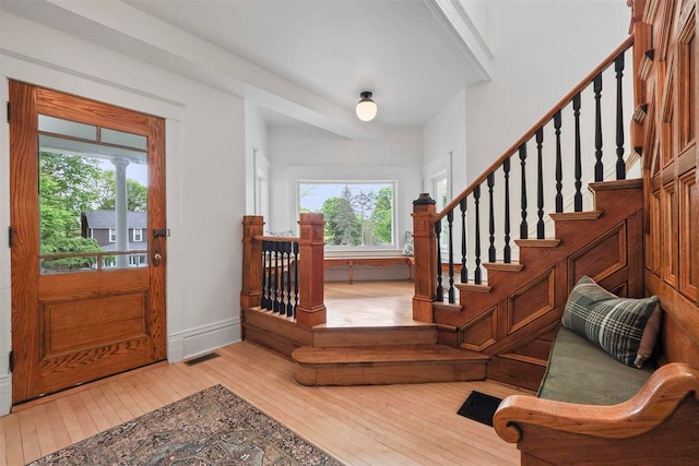 503 N Bridge St, Bellaire, MI 49615 - foyer entrance featuring hardwood / wood-style floors, stairway, and baseboards