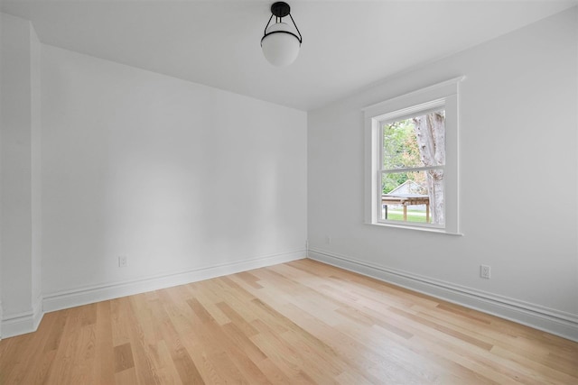 503 N Bridge St, Bellaire, MI 49615 - empty room featuring wood finished floors and baseboards