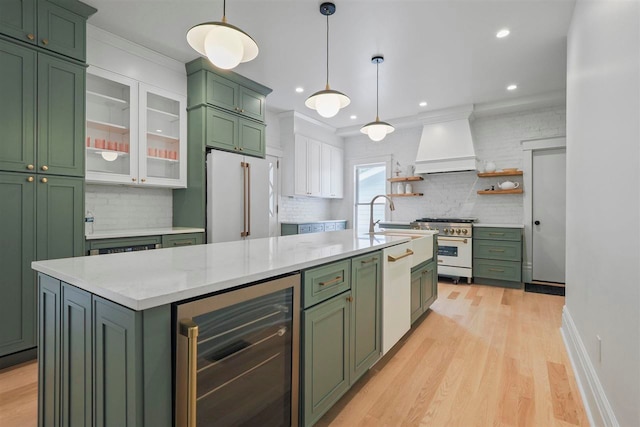503 N Bridge St, Bellaire, MI 49615 - kitchen featuring green cabinets, beverage cooler, custom range hood, white appliances, and recessed lighting