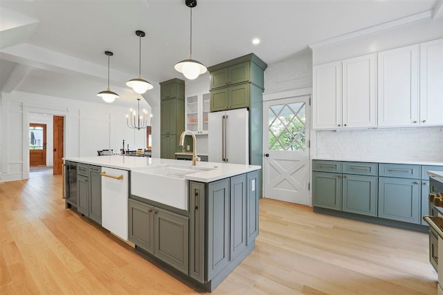 503 N Bridge St, Bellaire, MI 49615 - kitchen featuring white appliances, a sink, green cabinets, healthy amount of natural light, and recessed lighting