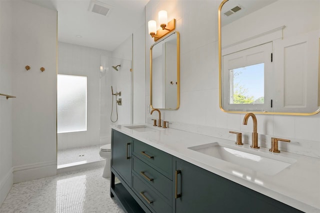503 N Bridge St, Bellaire, MI 49615 - full bath featuring plenty of natural light, toilet, and tiled shower
