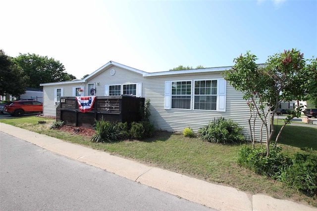 6685 M-66 Hwy, Charlevoix, MI 49720 - manufactured / mobile home with a front yard