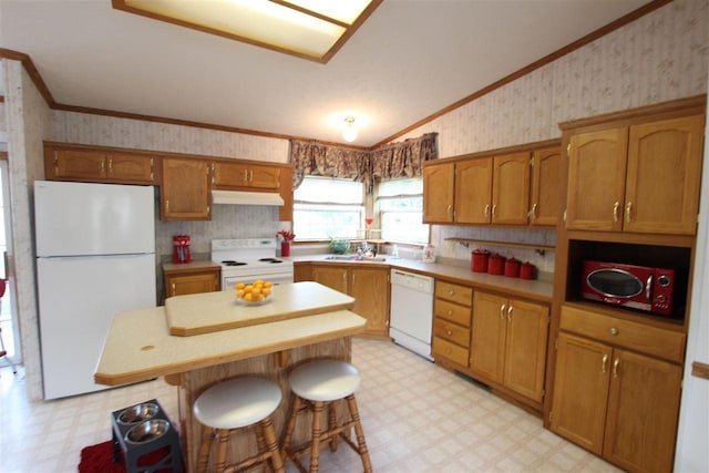 6685 M-66 Hwy, Charlevoix, MI 49720 - kitchen featuring white appliances, wallpapered walls, light flooring, under cabinet range hood, and ornamental molding