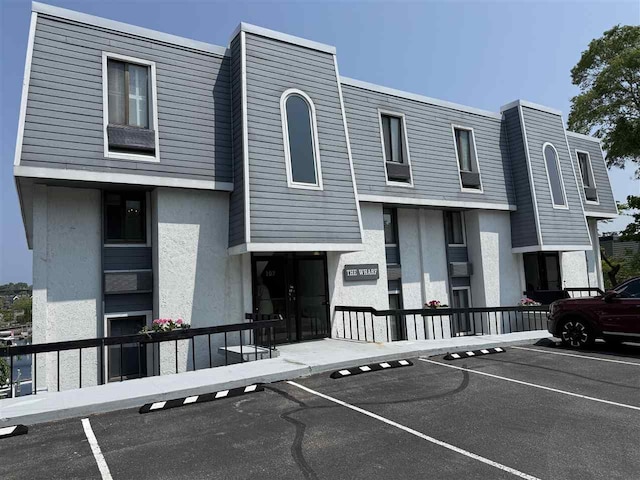 107 Belvedere Ave Unit A-3, Charlevoix, MI 49720 - view of property featuring uncovered parking
