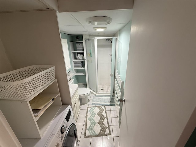 107 Belvedere Ave Unit A-3, Charlevoix, MI 49720 - bathroom with a shower stall, tile patterned floors, and washer / dryer